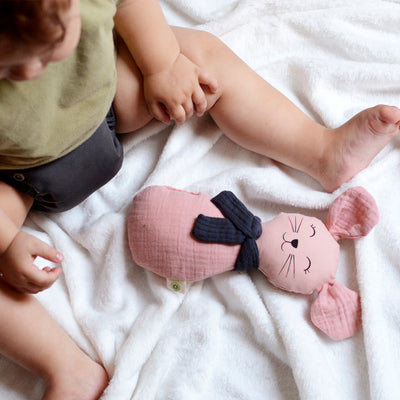Baby sitting on blanket with aPunt Barcelona rattle mouse