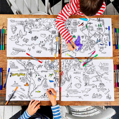 Two children colouring on eatsleepdoodle placemats of world map